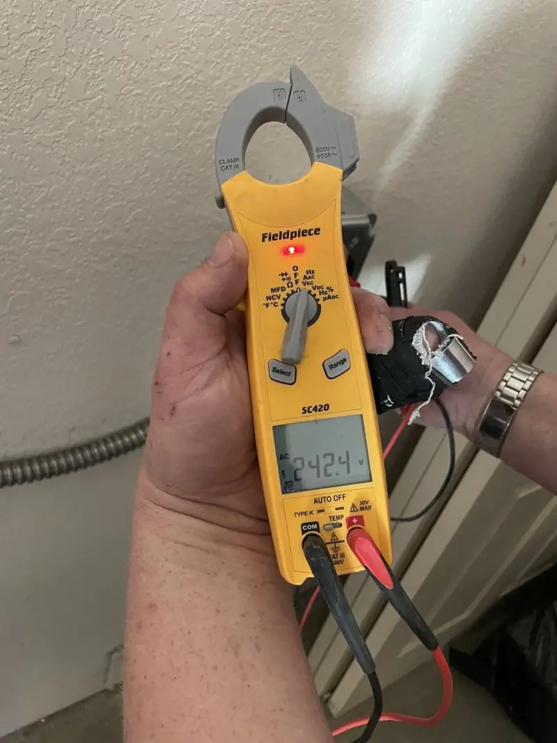 Voltage testing with clamp meter during Recessed Lighting Installation in Kennedale